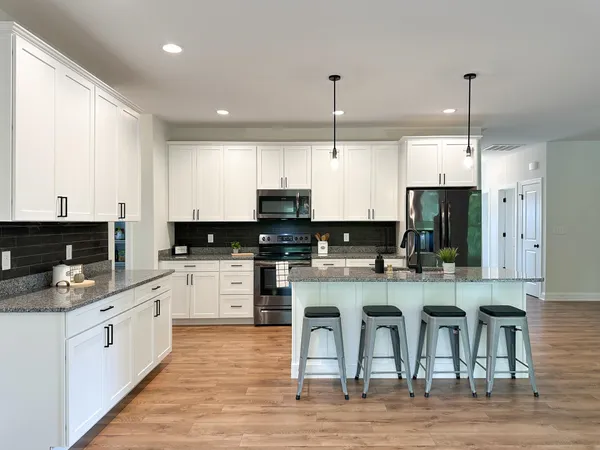 a large kitchen with cabinets