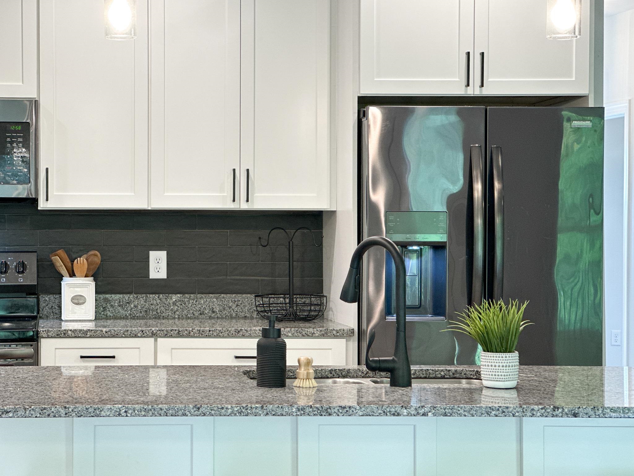 55 Mcilwee Lane Staunton, VA 24401 - Photo 17 of 40 a kitchen with stainless steel appliances granite countertop a sink a stove and a granite counter tops