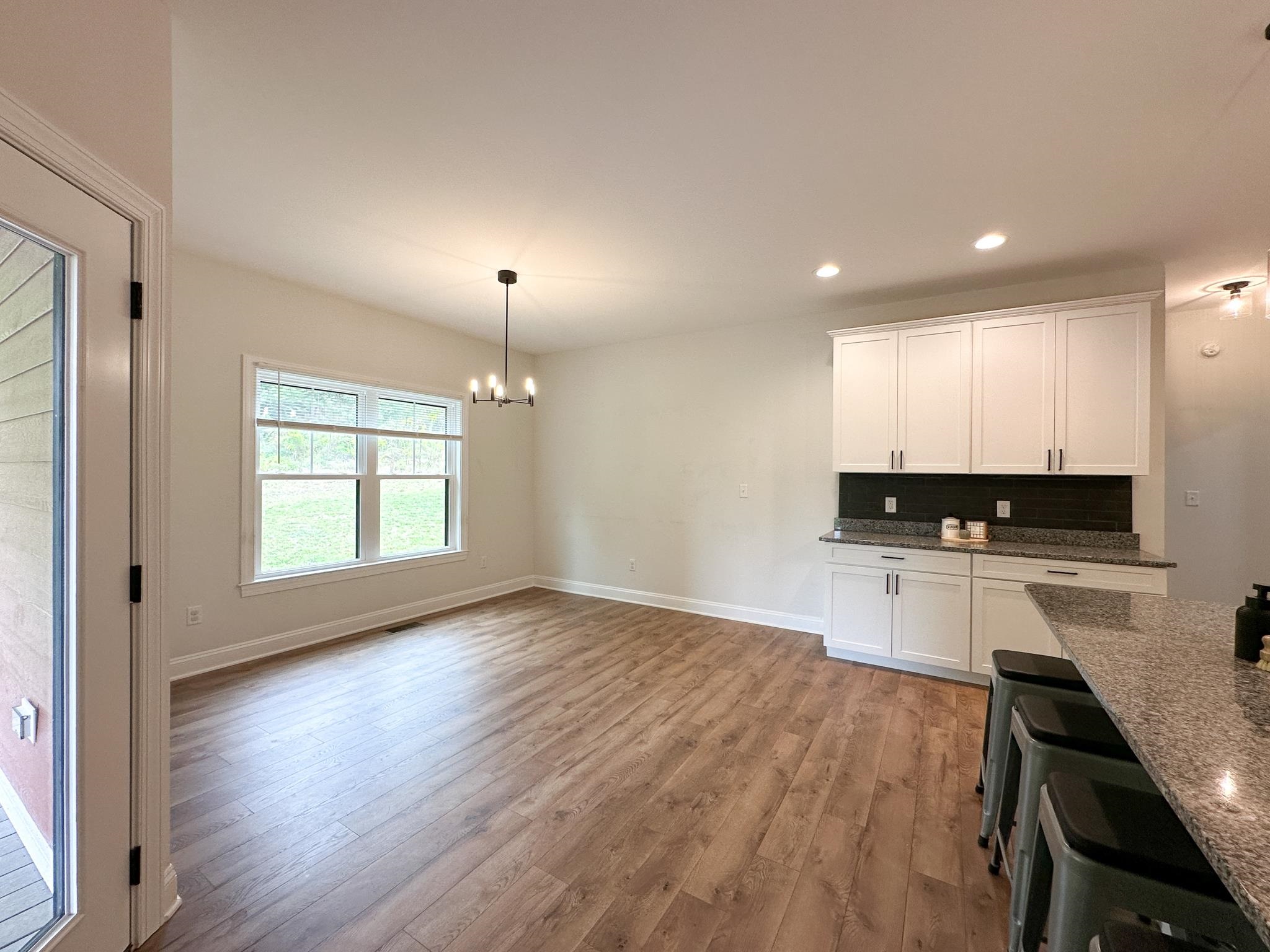 55 Mcilwee Lane Staunton, VA 24401 - Photo 23 of 40 a kitchen with a refrigerator a stove a sink and a wooden floor
