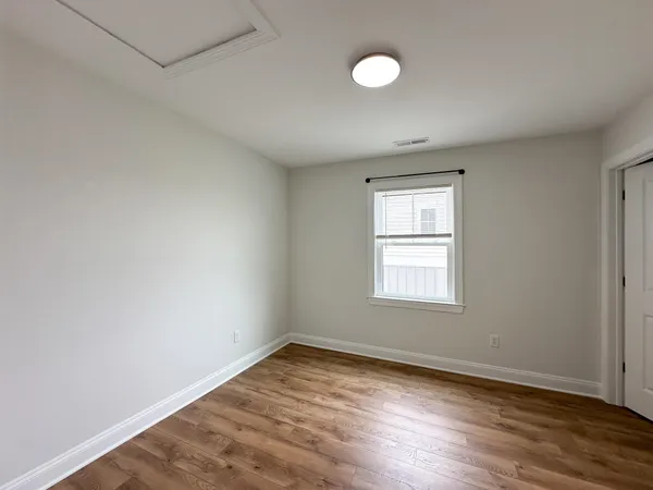 a bathroom with a double vanity sink a mirror and a bathtub
