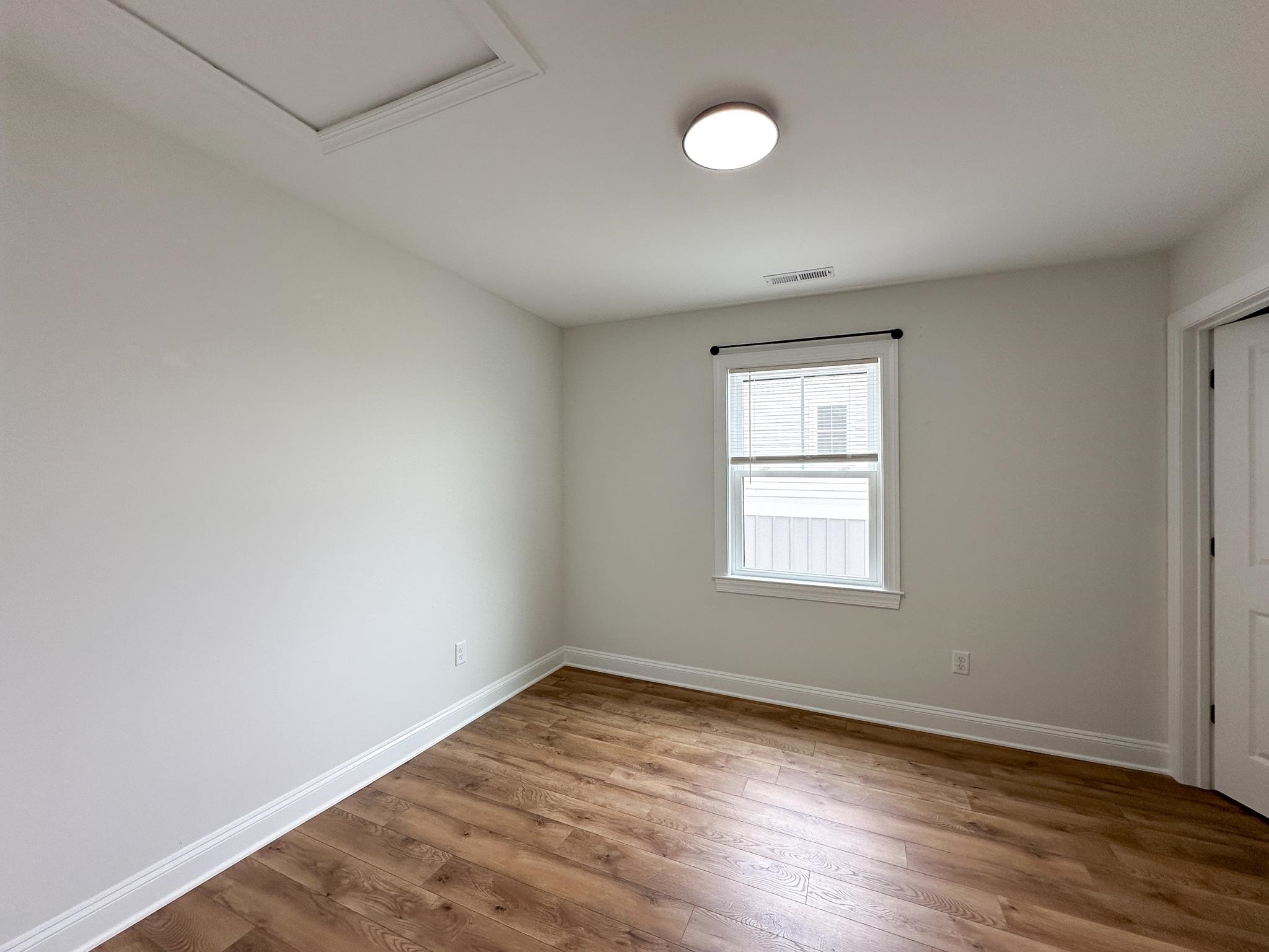 55 Mcilwee Lane Staunton, VA 24401 - Photo 35 of 40 an empty room with wooden floor and windows