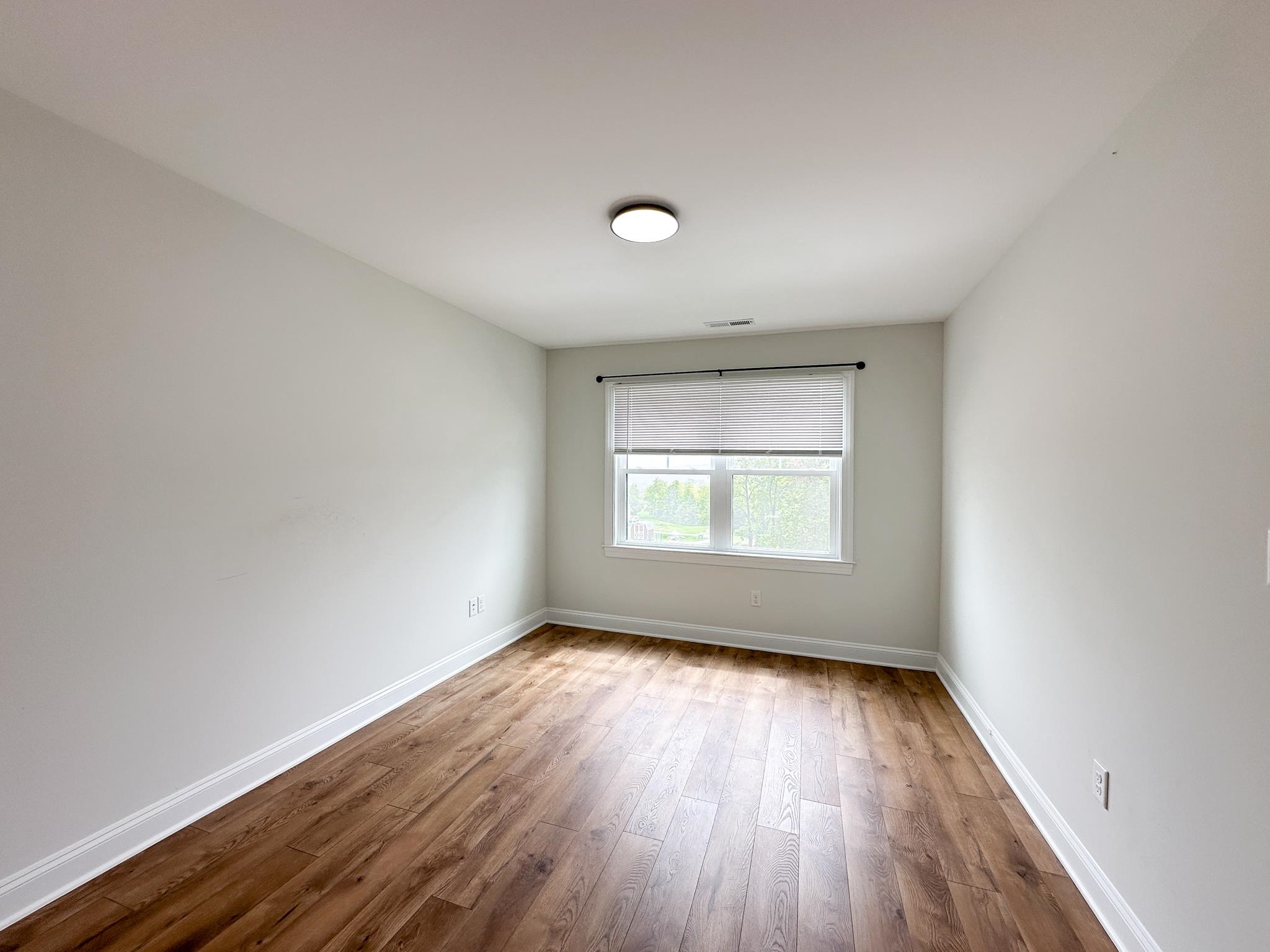 55 Mcilwee Lane Staunton, VA 24401 - Photo 38 of 40 an empty room with wooden floor and windows