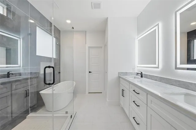 an empty room with wooden floor ceiling fan and windows