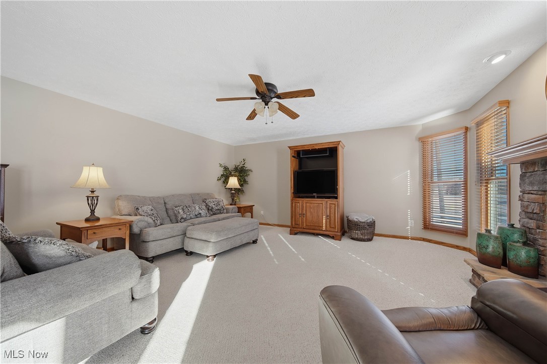 2132 Summerchase Road Northeast Canton, OH 44721 - Photo 16 of 49 Living room with carpet and a ceiling fan
