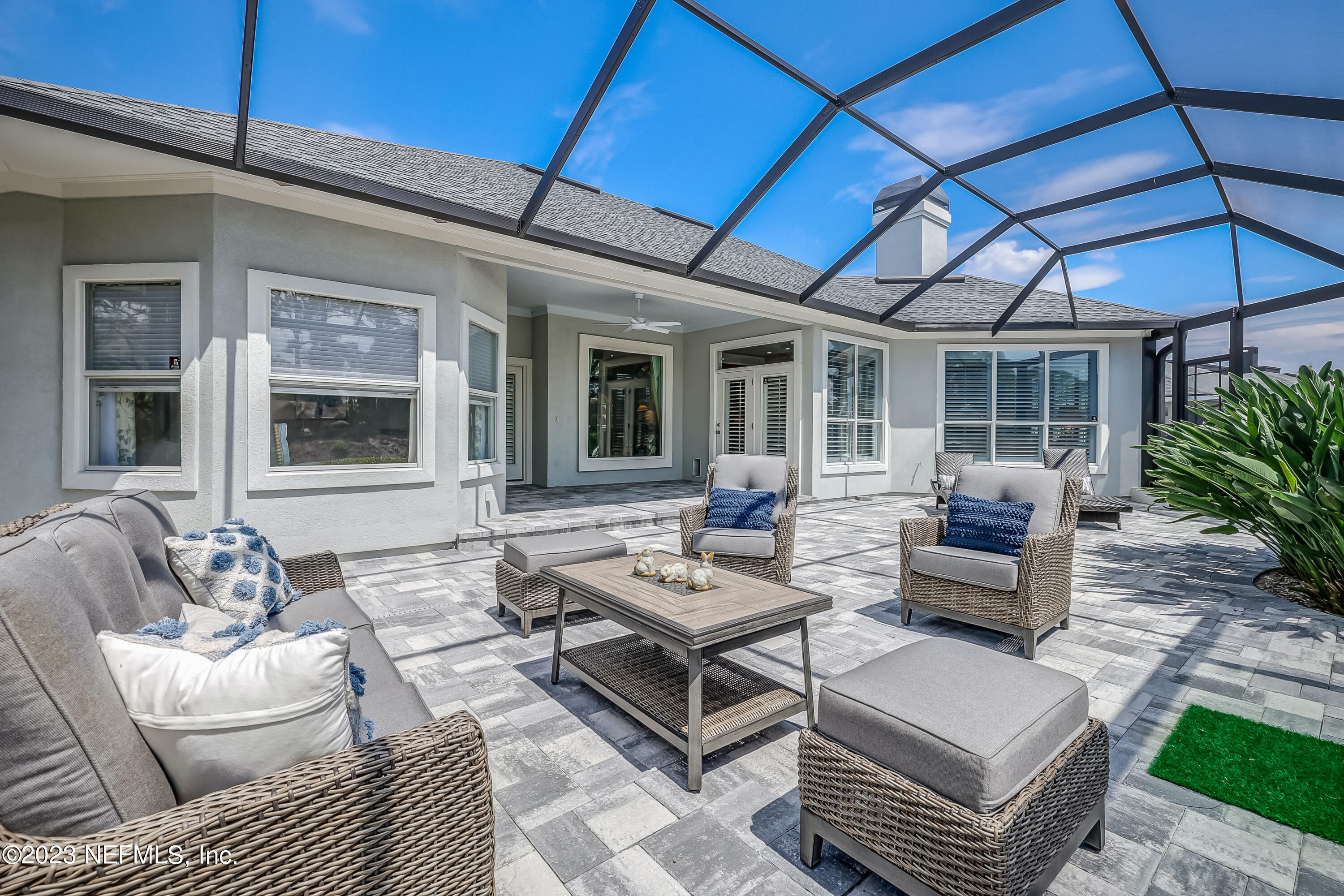 a outdoor living space with furniture and a umbrella