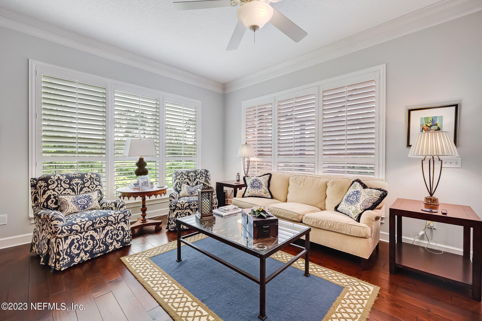 8026 Pine Lake Road Jacksonville, FL 32256 - Photo 19 of 43 a living room with furniture and a large window