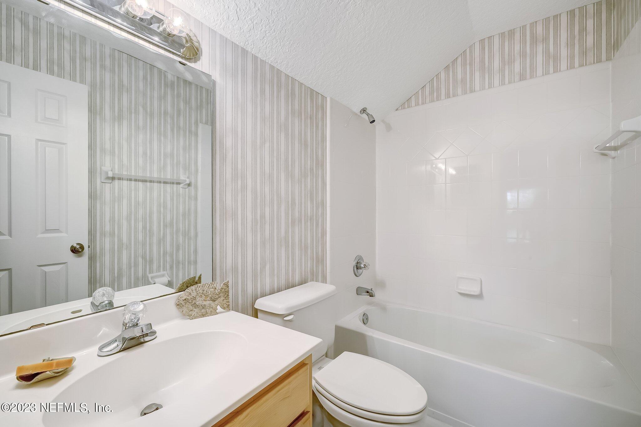 8026 Pine Lake Road Jacksonville, FL 32256 - Photo 30 of 43 a bathroom with a sink toilet and shower