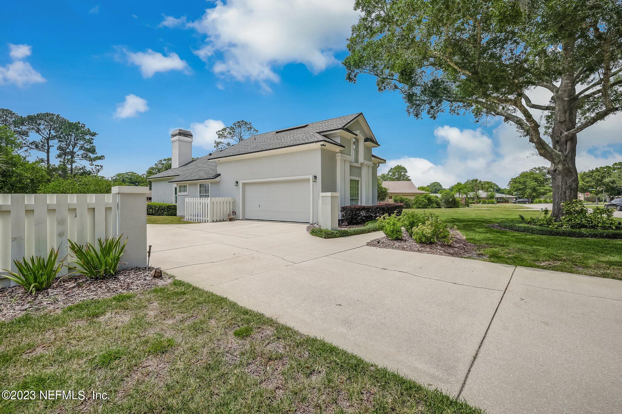 8026 Pine Lake Road Jacksonville, FL 32256 - Photo 35 of 43 a view of a front of house with a yard