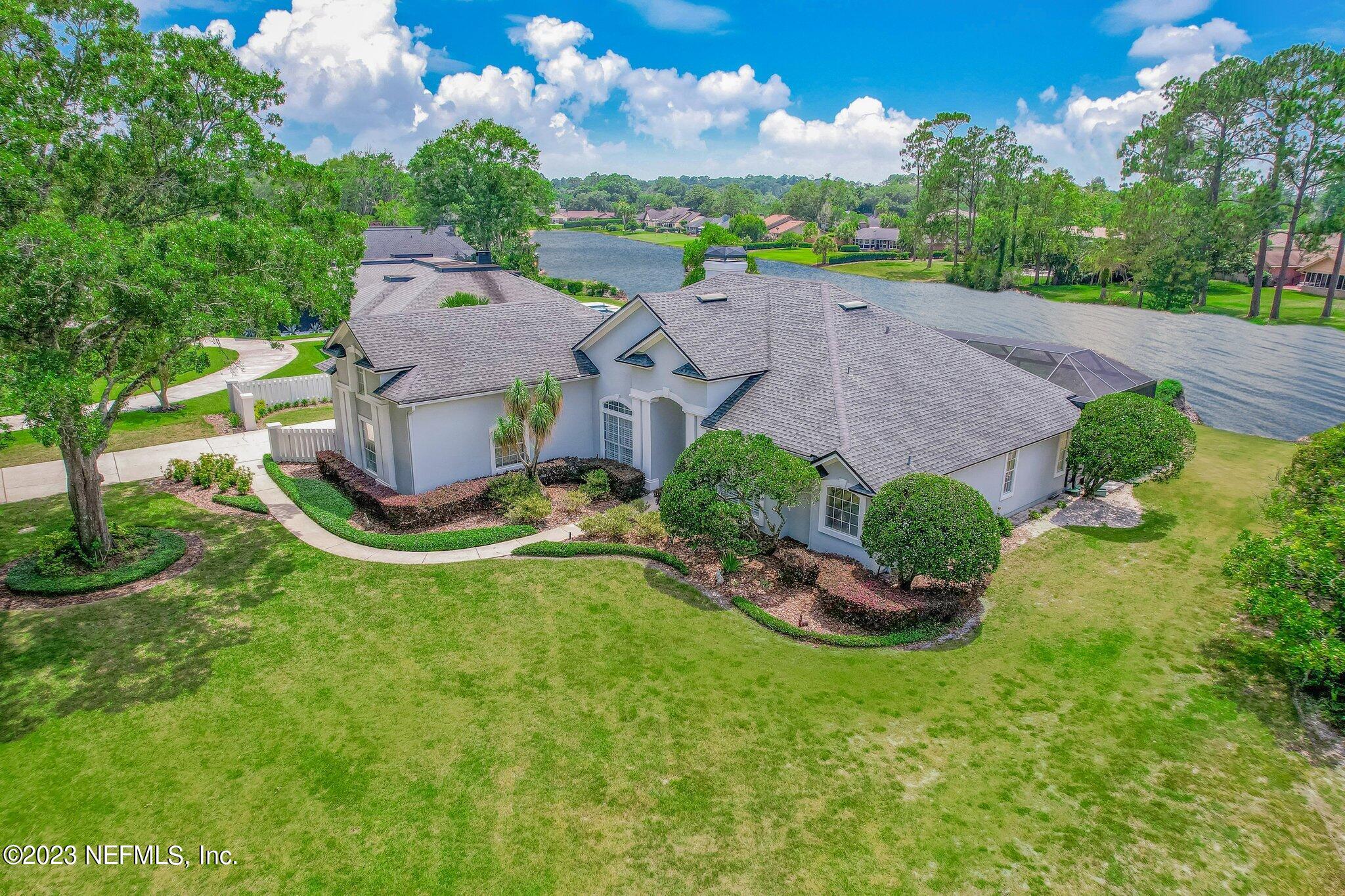 8026 Pine Lake Road Jacksonville, FL 32256 - Photo 36 of 43 an aerial view of a house with garden space and a street view