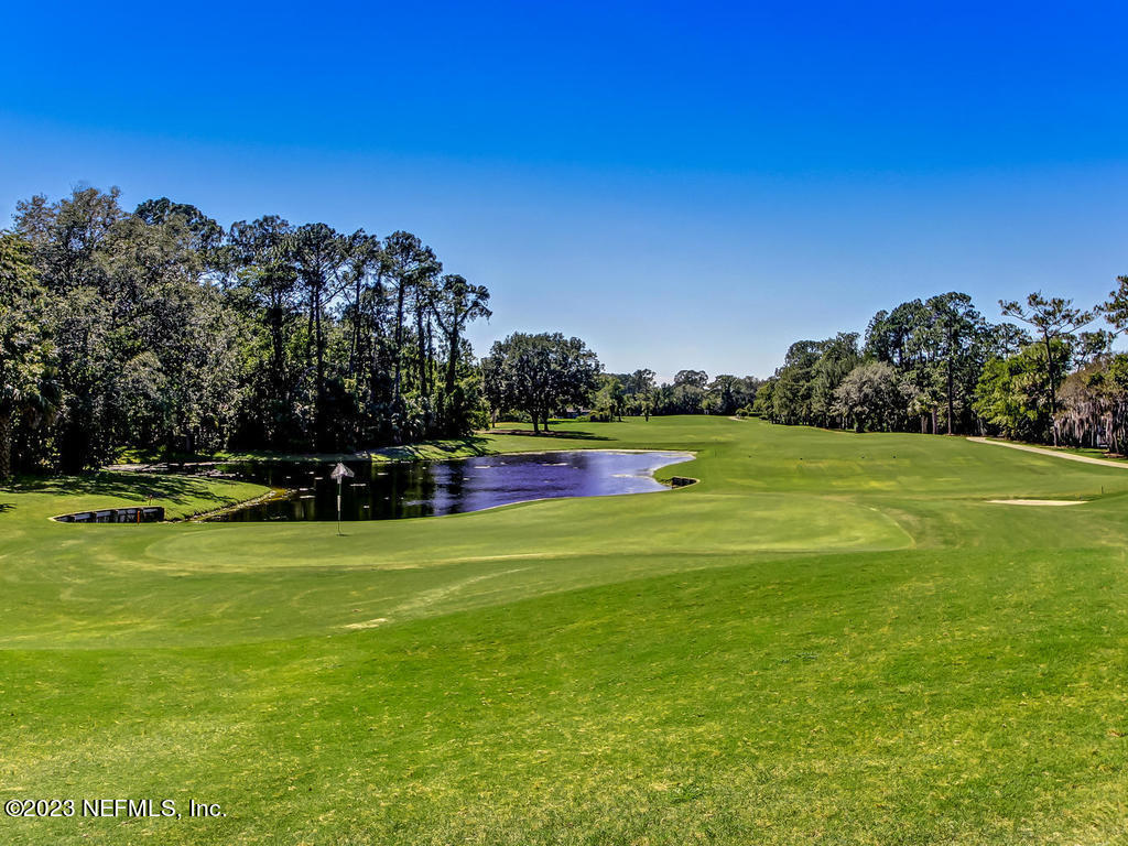 8026 Pine Lake Road Jacksonville, FL 32256 - Photo 39 of 43 a view of a golf course with a lake