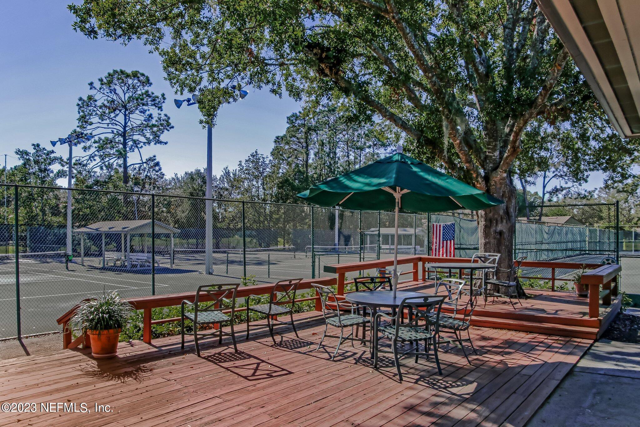 8026 Pine Lake Road Jacksonville, FL 32256 - Photo 40 of 43 an outdoor space with seating