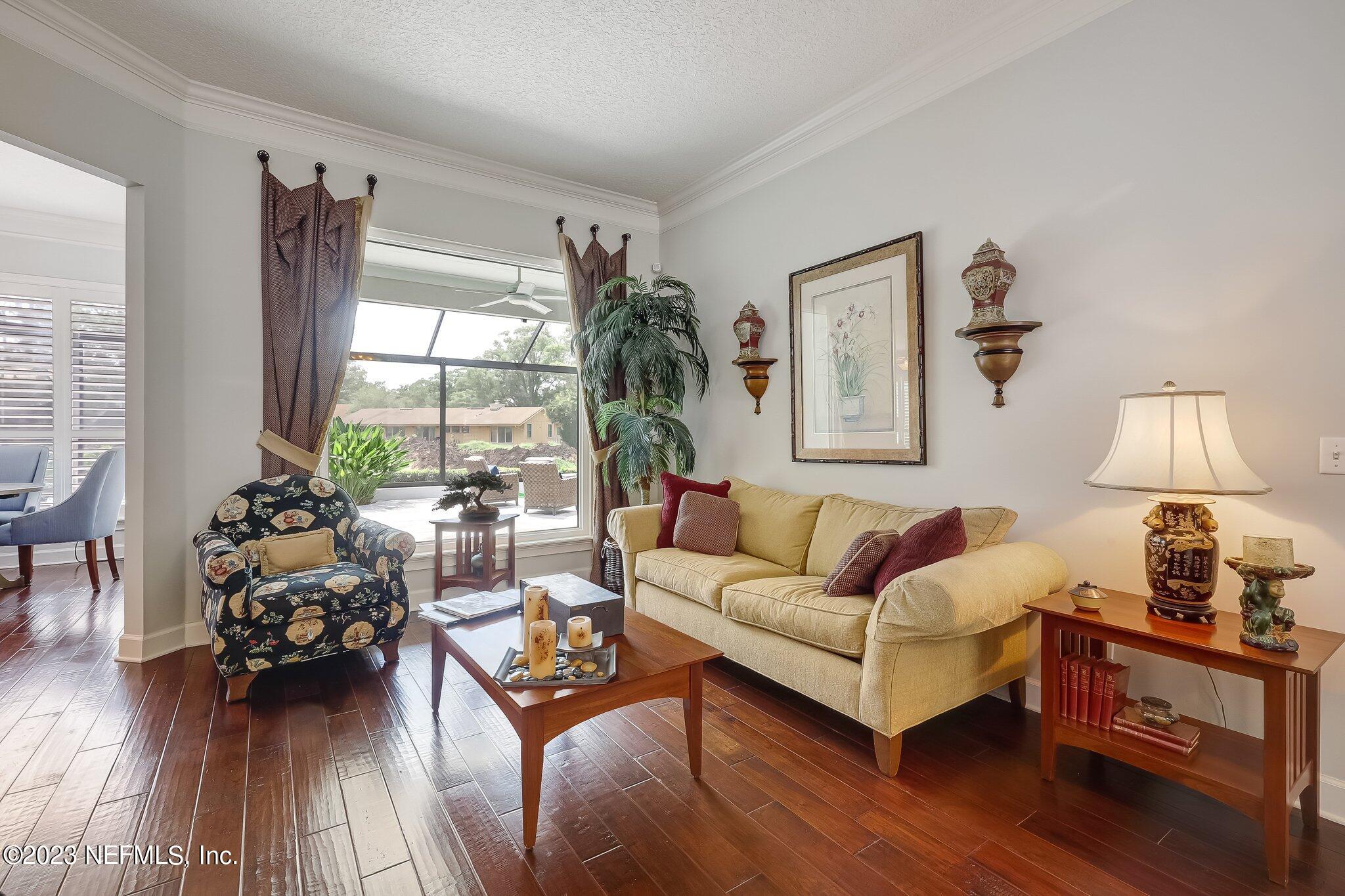 8026 Pine Lake Road Jacksonville, FL 32256 - Photo 5 of 43 a living room with furniture and wooden floor