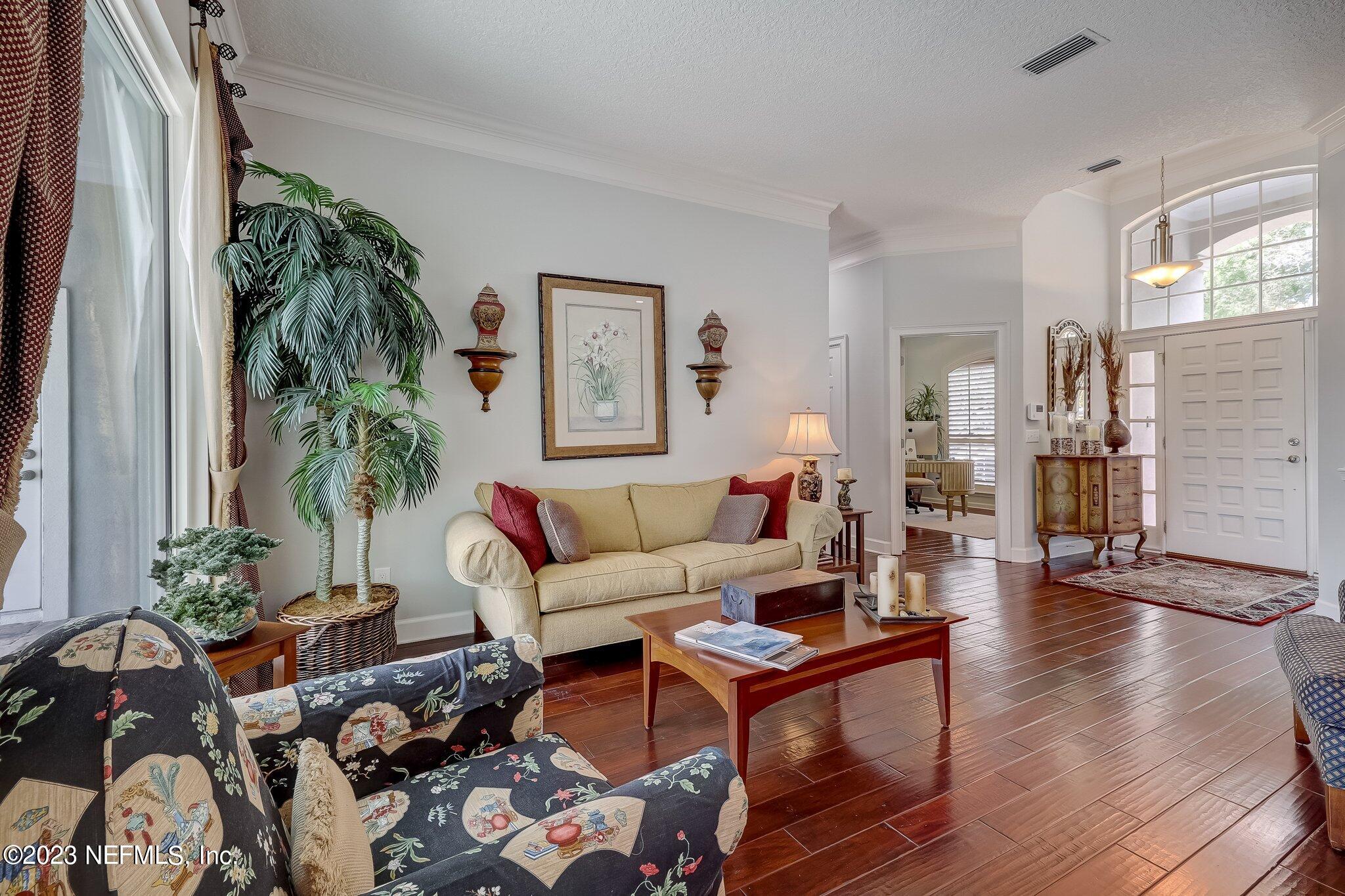 8026 Pine Lake Road Jacksonville, FL 32256 - Photo 7 of 43 a living room with furniture and a potted plant