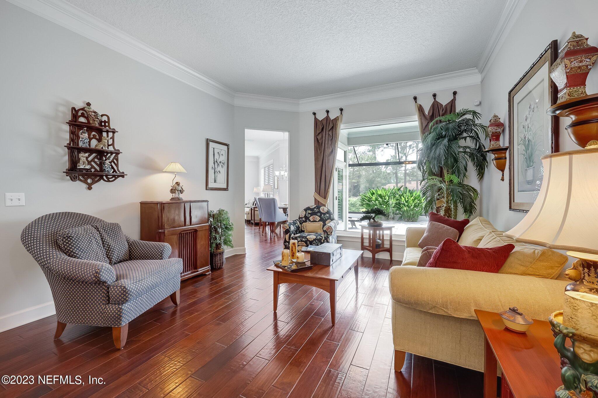 8026 Pine Lake Road Jacksonville, FL 32256 - Photo 8 of 43 a living room with furniture and a potted plant