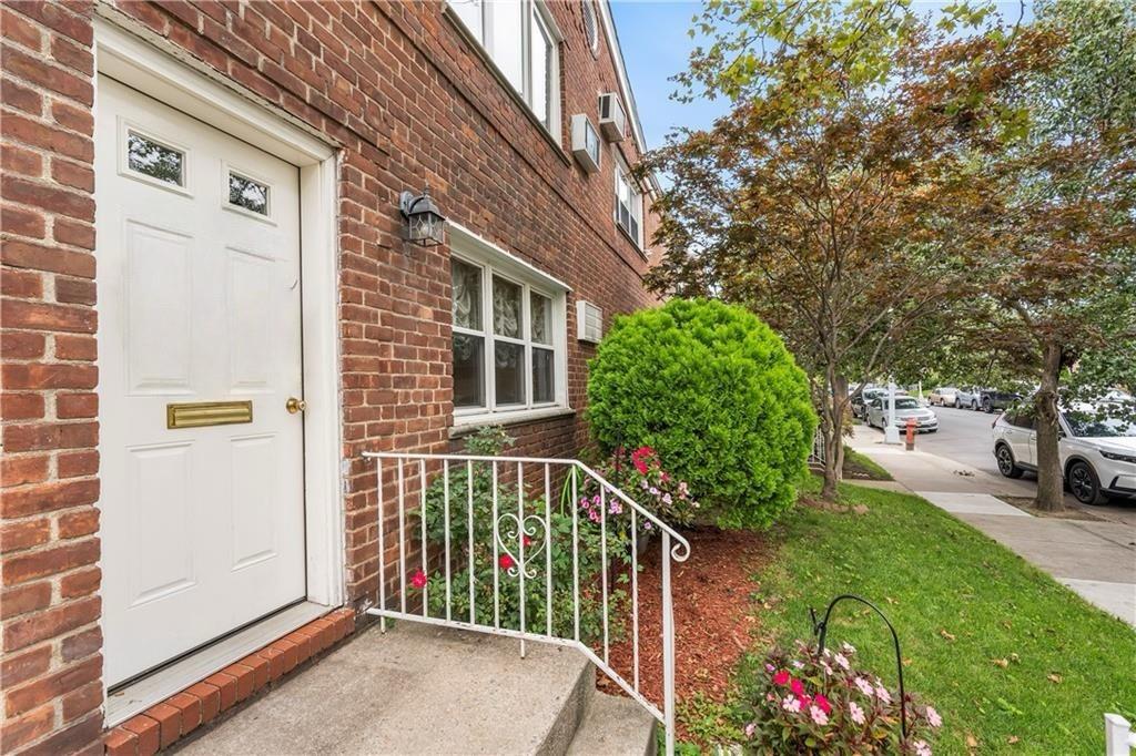 289 Bay 19th Street, Unit B Brooklyn, NY 11214 - Photo 2 of 2 a view of a house with a yard and potted plants