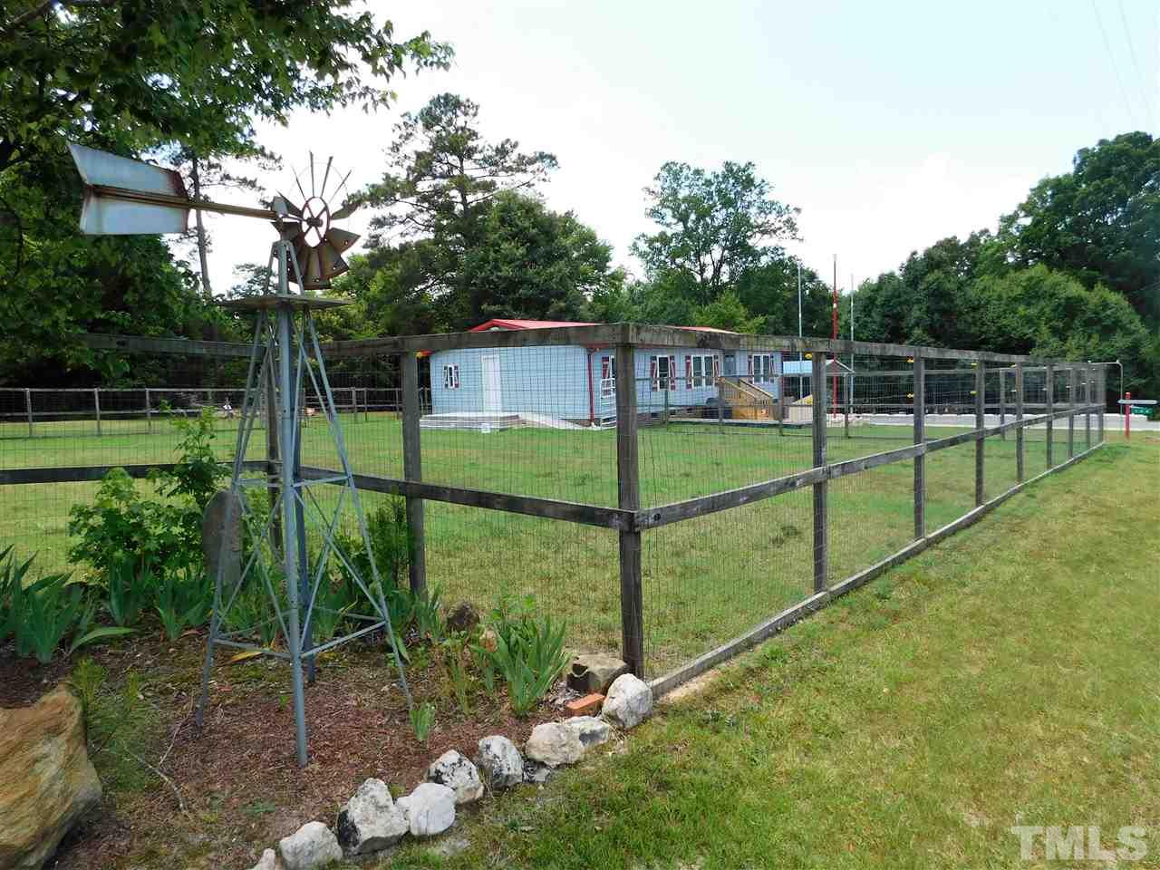 164 Clyde Pearce Road Zebulon, NC 27597 - Photo 3 of 25 a view of a backyard