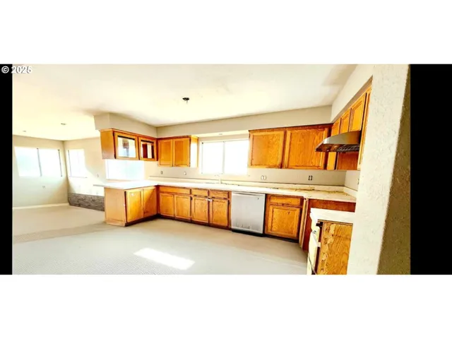 a en suite bathroom with a tub sink and mirror