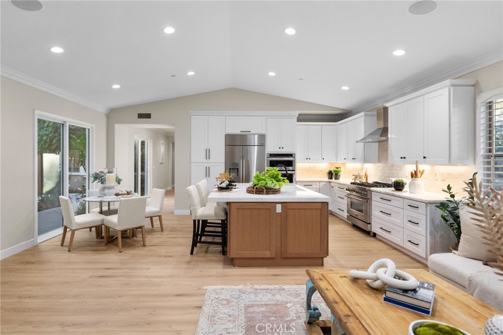 45 Shade Tree Irvine, CA 92603 - Photo 21 of 62 a living room with furniture kitchen area and a wooden floor