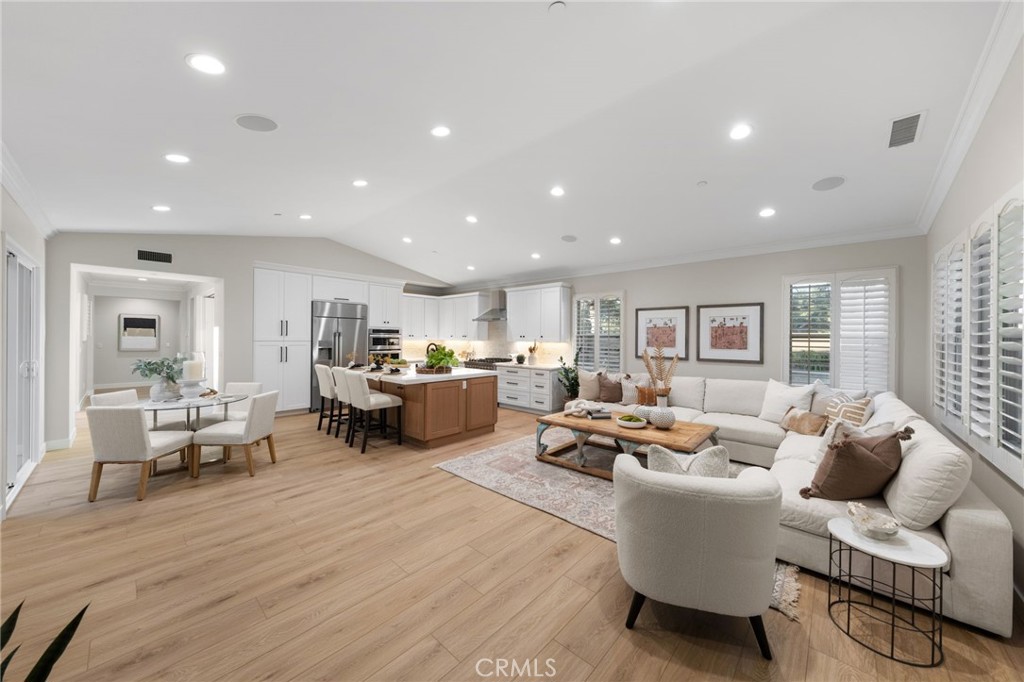 45 Shade Tree Irvine, CA 92603 - Photo 22 of 62 a living room with furniture and a wooden floor