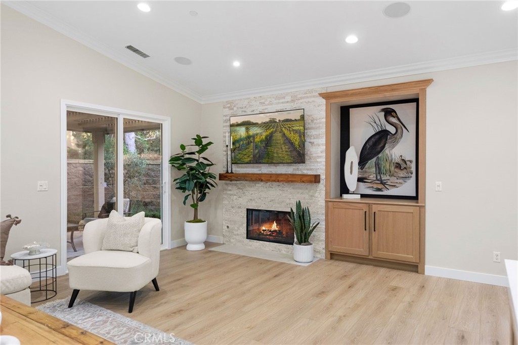 45 Shade Tree Irvine, CA 92603 - Photo 23 of 62 a living room with furniture and a fireplace