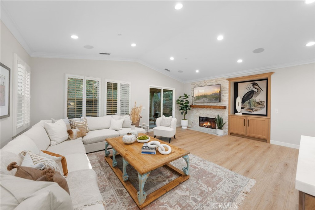 45 Shade Tree Irvine, CA 92603 - Photo 24 of 62 a living room with furniture fireplace and window