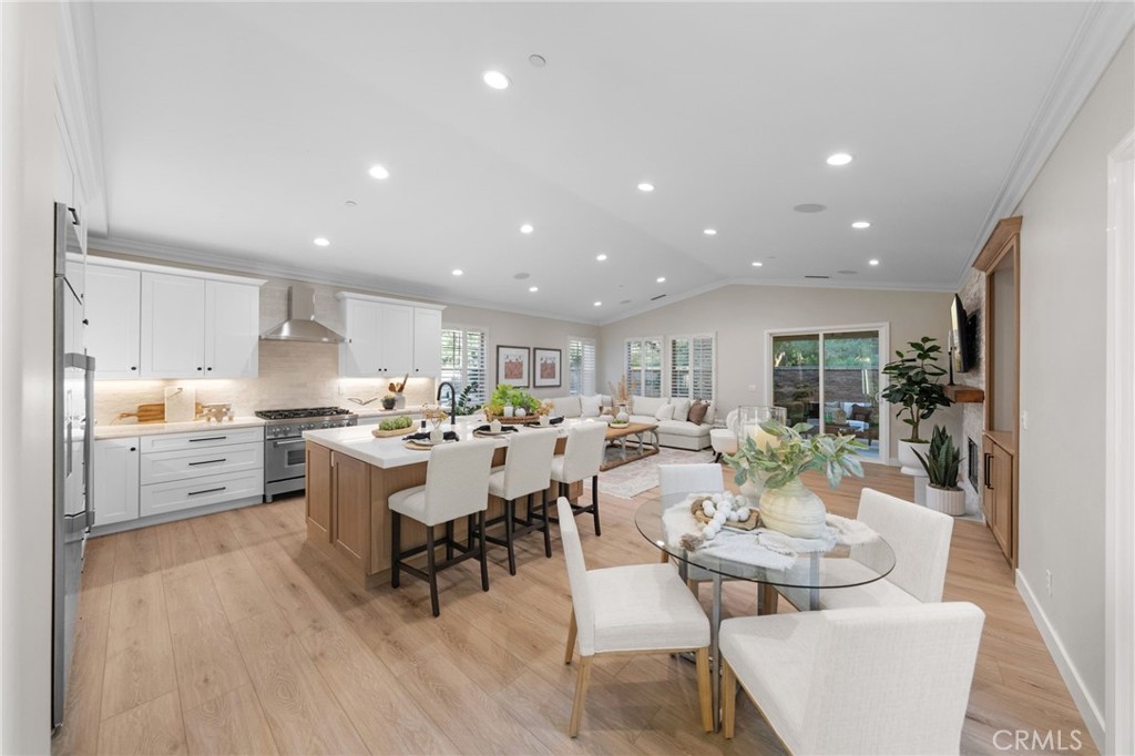 45 Shade Tree Irvine, CA 92603 - Photo 26 of 62 a large kitchen with a table and chairs in it