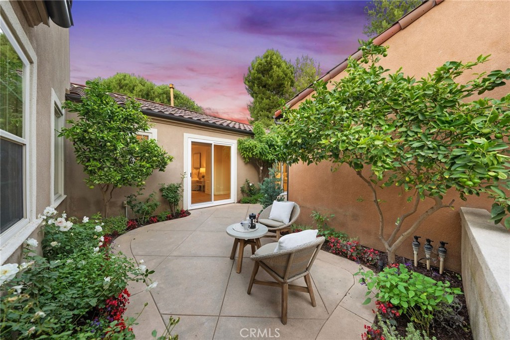45 Shade Tree Irvine, CA 92603 - Photo 46 of 62 a view of a patio with table and chairs and potted plants