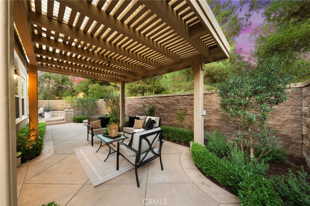 45 Shade Tree Irvine, CA 92603 - Photo 49 of 62 a patio with glass top table and chairs