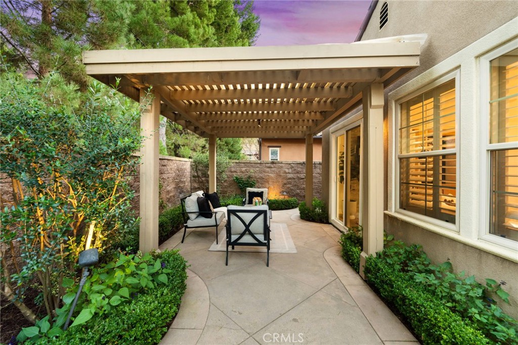 45 Shade Tree Irvine, CA 92603 - Photo 50 of 62 a view of a patio with table and chairs and potted plants