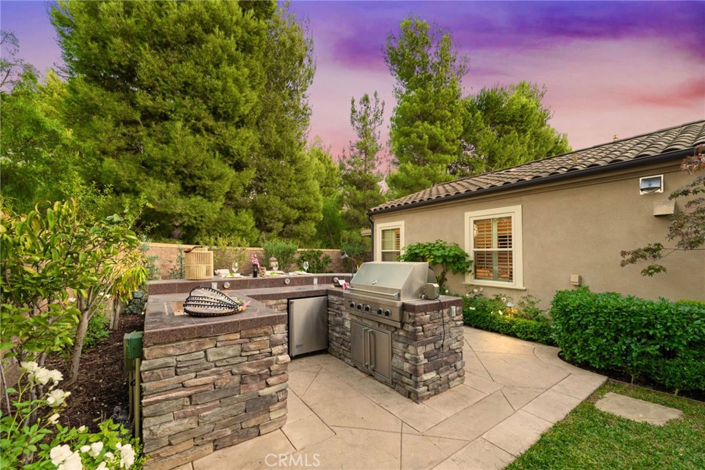 45 Shade Tree Irvine, CA 92603 - Photo 51 of 62 a view of a patio with table and chairs potted plants with wooden fence