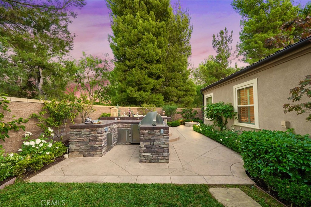 45 Shade Tree Irvine, CA 92603 - Photo 52 of 62 a view of backyard with a garden and seating area