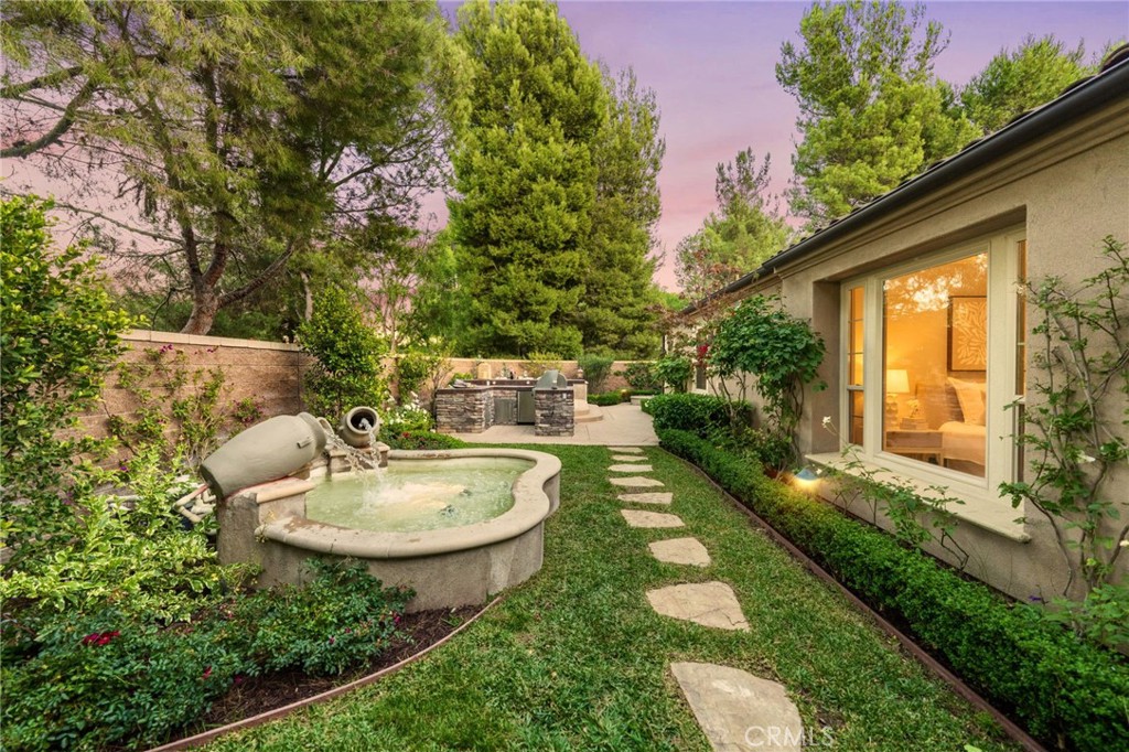 45 Shade Tree Irvine, CA 92603 - Photo 6 of 62 a backyard of a house with fountain table and chairs