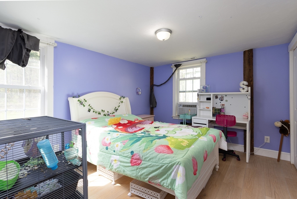 122 Wallace Road Sturbridge, MA 01566 - Photo 17 of 40 a bedroom with a bed and windows