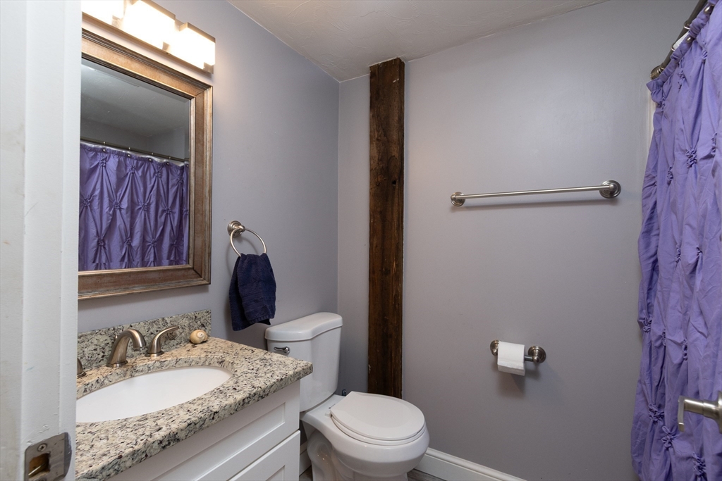 122 Wallace Road Sturbridge, MA 01566 - Photo 18 of 40 a bathroom with a granite countertop sink toilet and shower