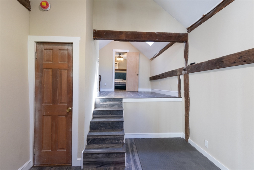 122 Wallace Road Sturbridge, MA 01566 - Photo 27 of 40 a view of entryway and hall with wooden floor