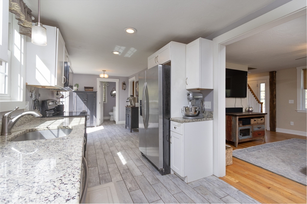 122 Wallace Road Sturbridge, MA 01566 - Photo 6 of 40 a kitchen with stainless steel appliances granite countertop a refrigerator and a sink