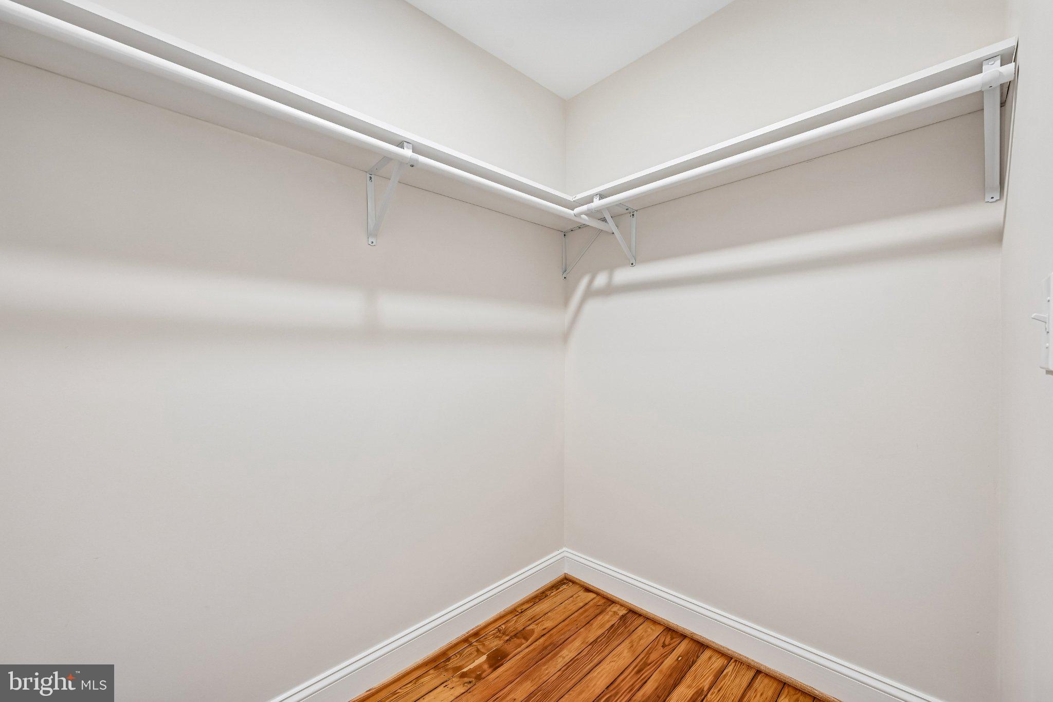 5714 Rusk Avenue Baltimore, MD 21215 - Photo 33 of 51 Spacious closet with warm wood floors.