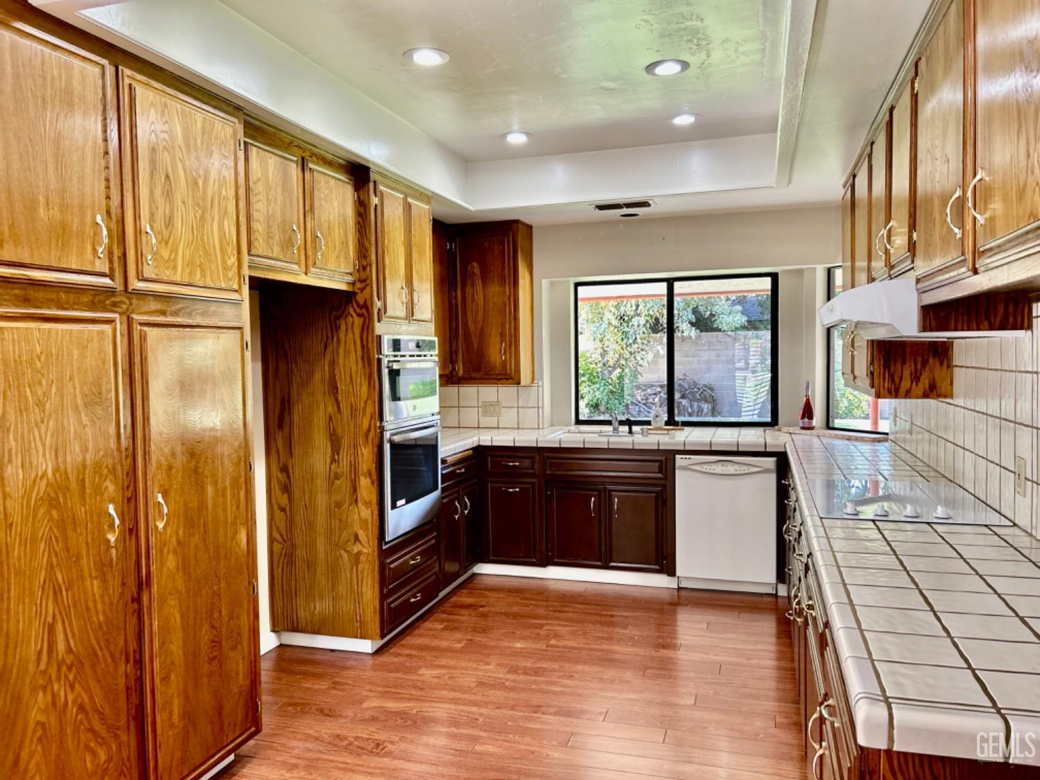 Undisclosed Address Bakersfield, CA 93309 - Photo 8 of 14 a kitchen with stainless steel appliances granite countertop a refrigerator and a sink