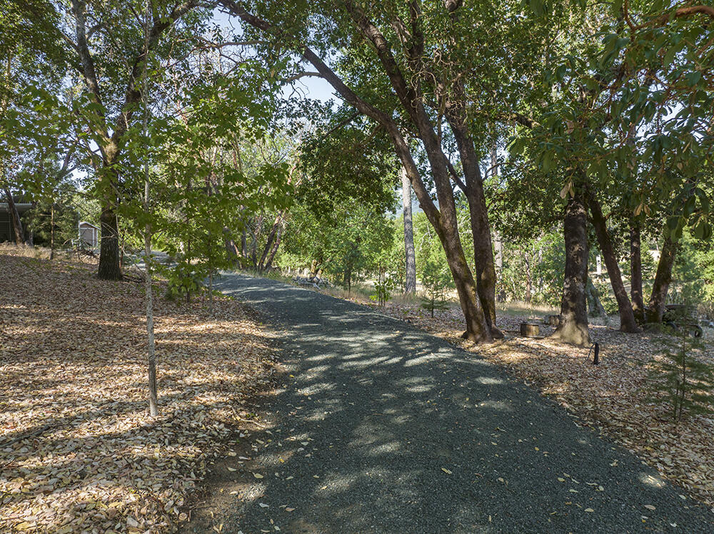 375 Oak Ranch Road Grants Pass, OR 97526 - Photo 54 of 57 a backyard of a house with lots of green space