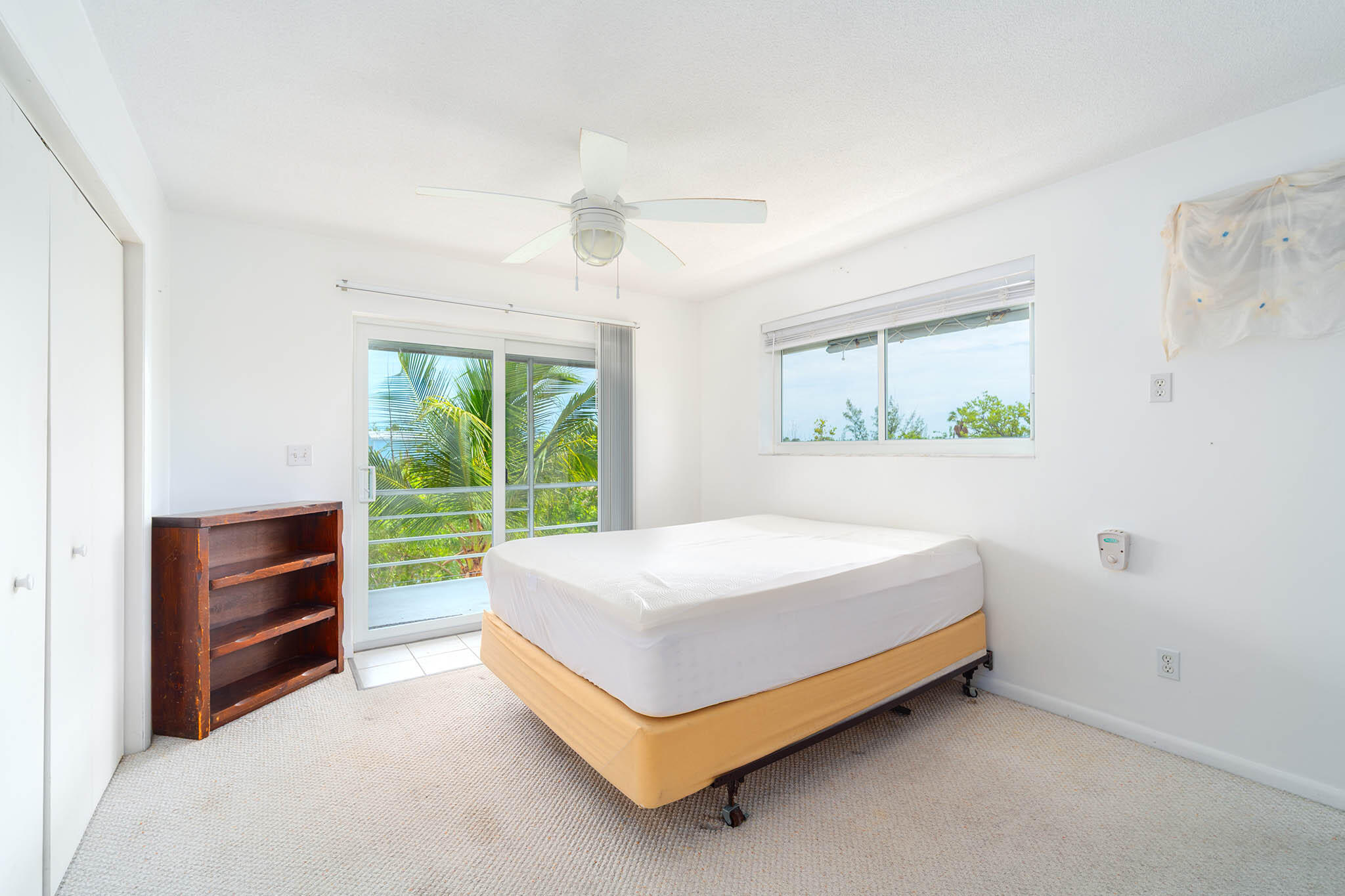 29849 Newfound Boulevard Big Pine Key, FL 33043 - Photo 13 of 25 a bedroom with a bed and a window