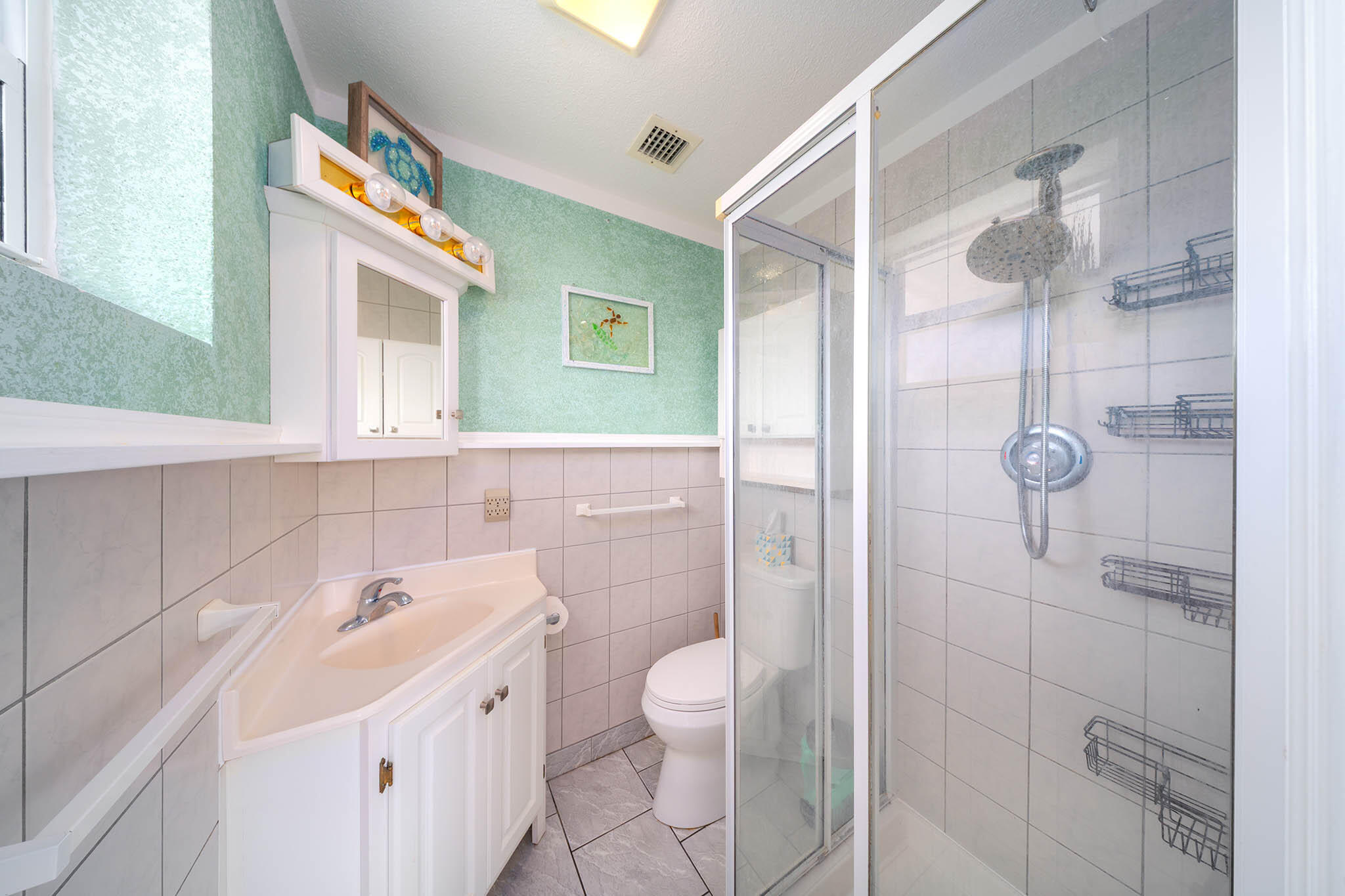 29849 Newfound Boulevard Big Pine Key, FL 33043 - Photo 14 of 25 a bathroom with a sink a toilet and shower