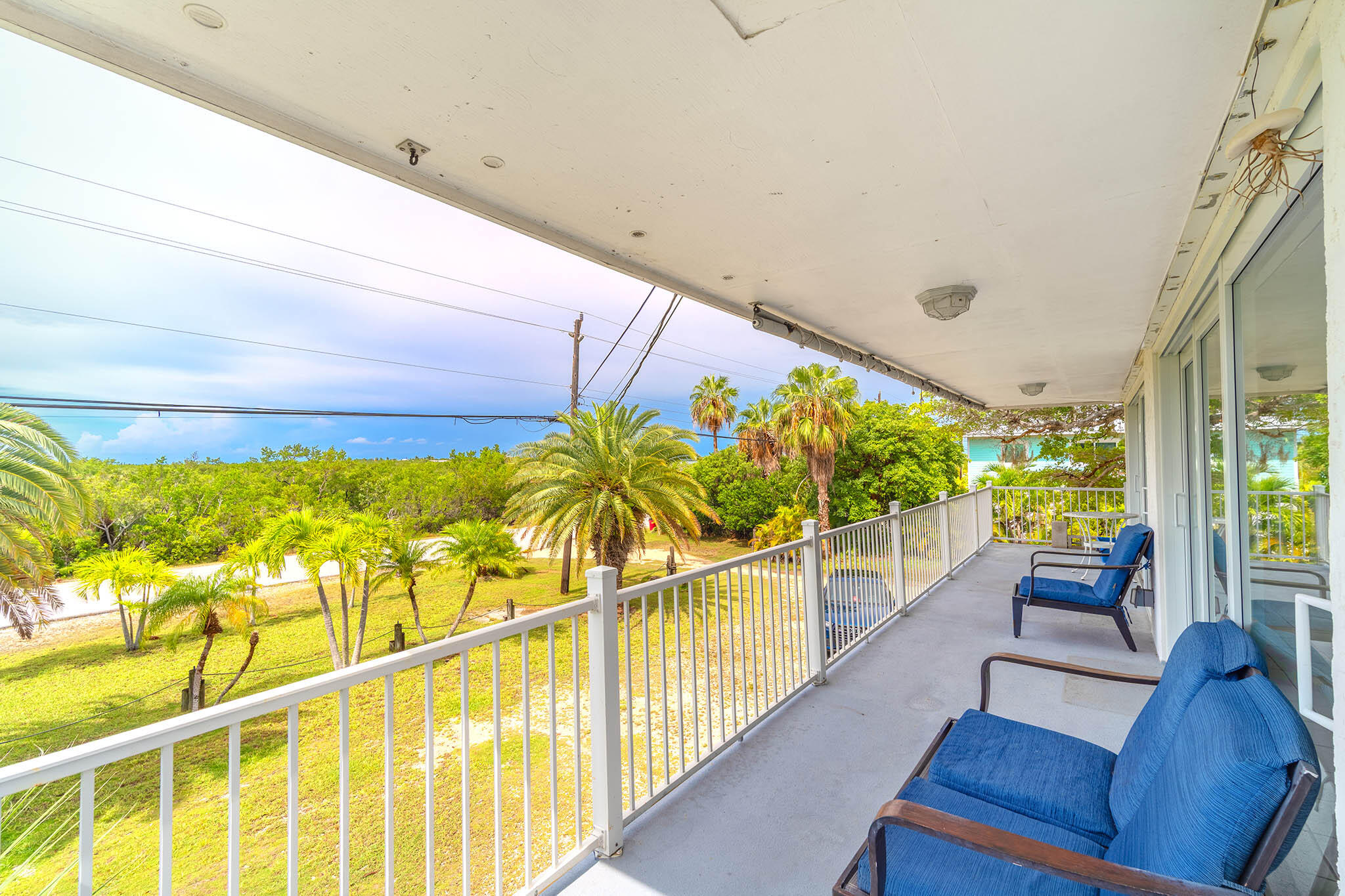 29849 Newfound Boulevard Big Pine Key, FL 33043 - Photo 19 of 25 a view of an chairs and table on the balcony