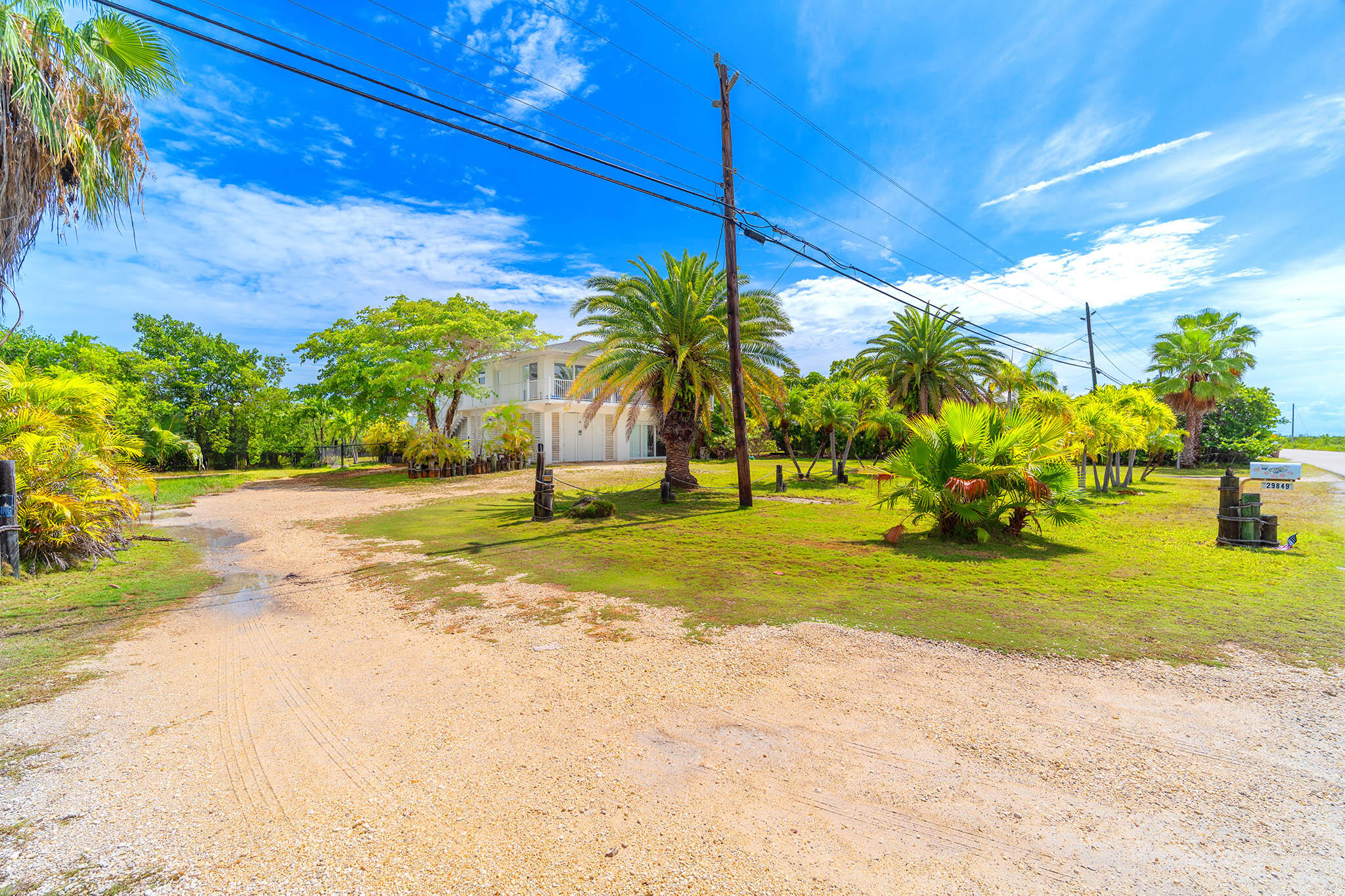 29849 Newfound Boulevard Big Pine Key, FL 33043 - Photo 21 of 25 a view of a yard and basketball court