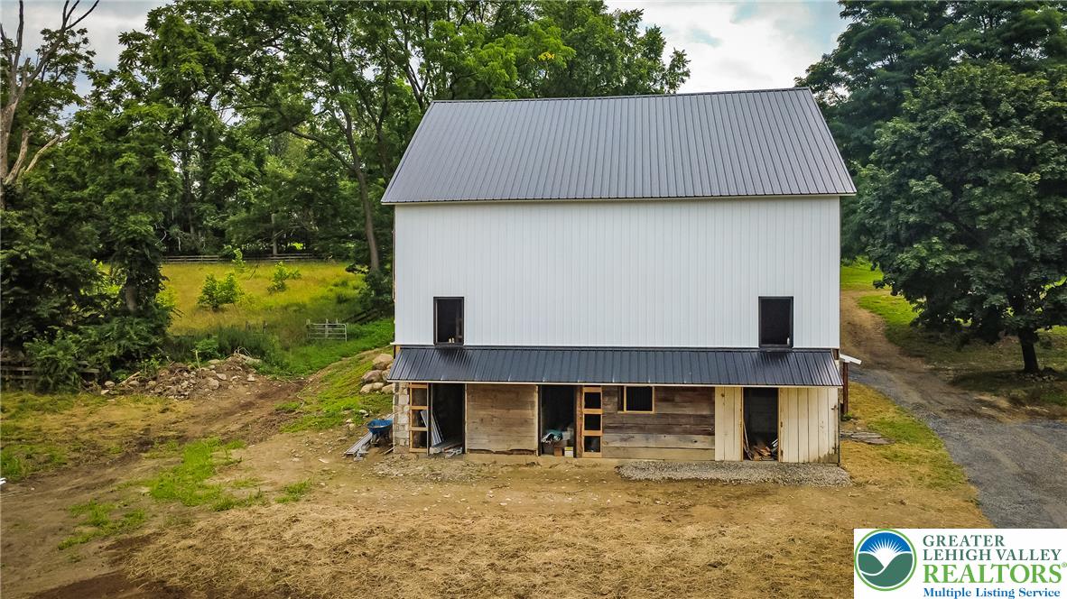 72 Allegheny Road Mount Bethel, PA 18343 - Photo 54 of 72 A new barn-style residence poised on a gentle slope, surrounded by mature trees.