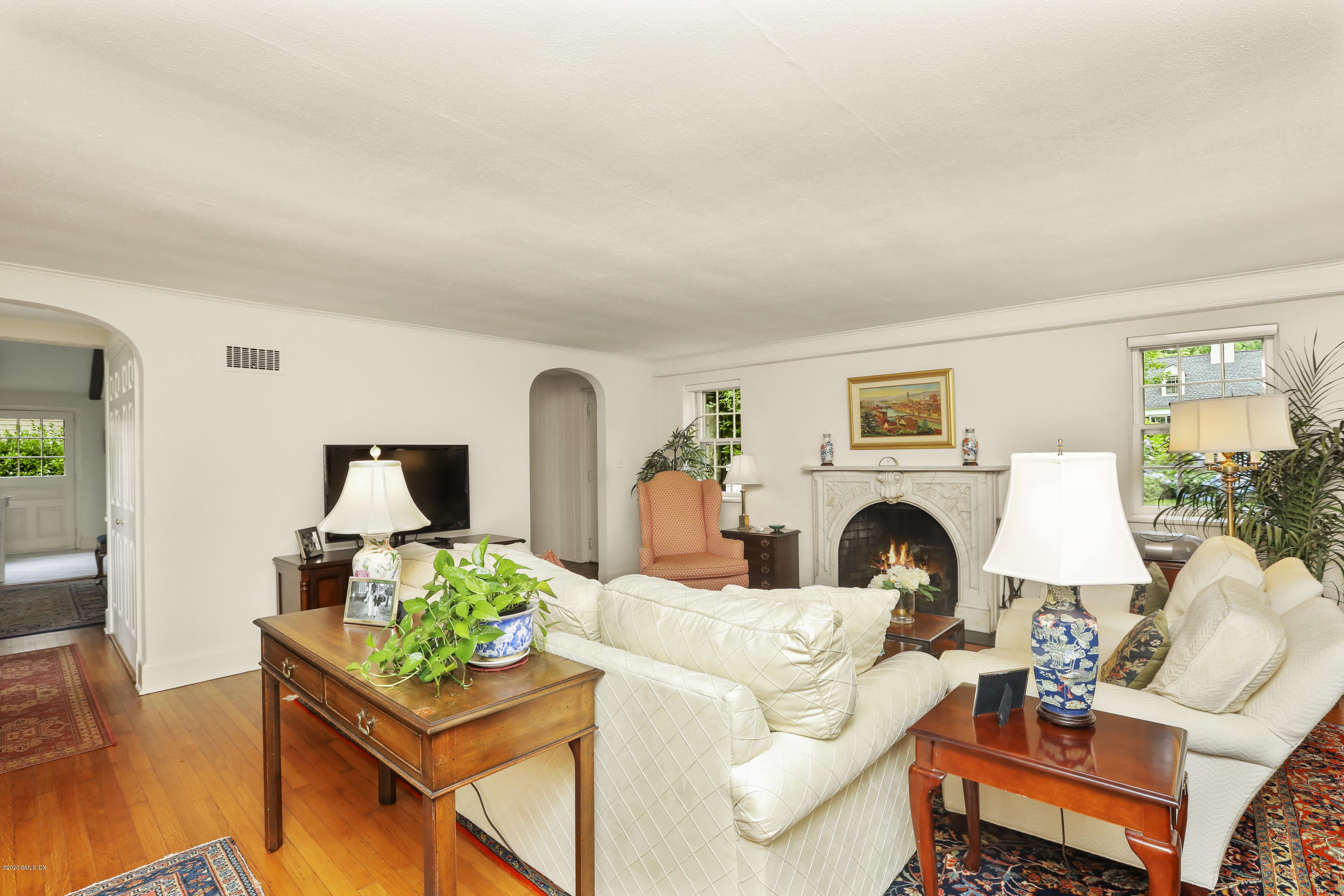 14 Hidden Brook Road Riverside, CT 06878 - Photo 5 of 13 a living room with furniture a fireplace and a potted plant