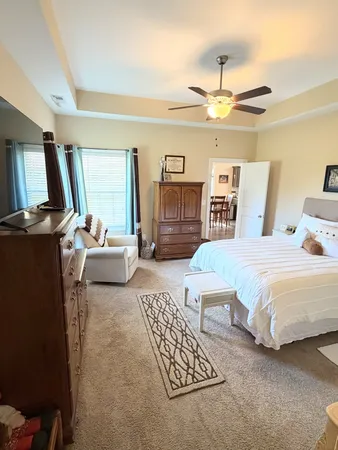 a bedroom with a bed and furniture