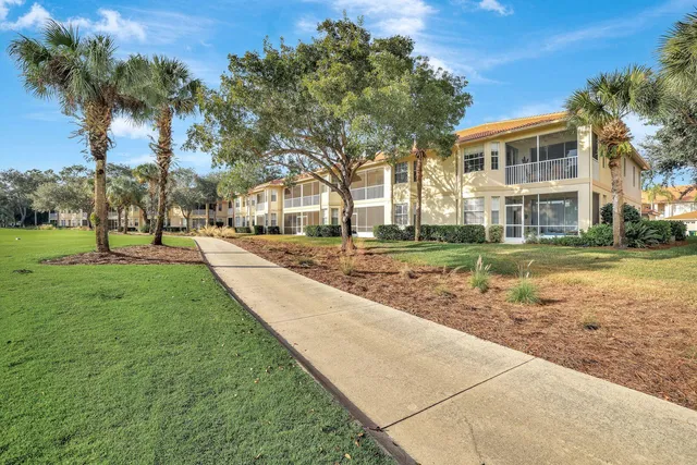a view of a lake with houses in the back