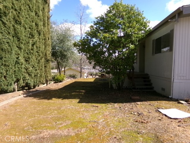 323 Ridgecrest Parkway Oroville, CA 95966 - Photo 2 of 35 a view of a backyard of the house