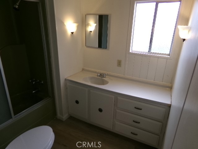 323 Ridgecrest Parkway Oroville, CA 95966 - Photo 22 of 35 a bathroom with a toilet sink vanity and mirror