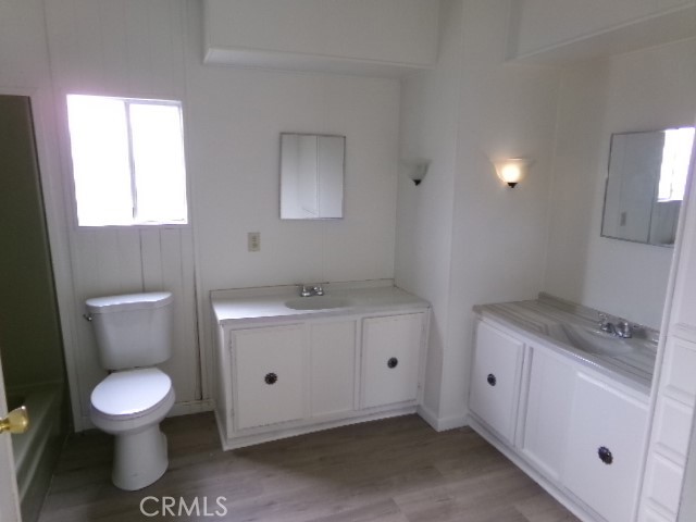 323 Ridgecrest Parkway Oroville, CA 95966 - Photo 8 of 35 a bathroom with a sink a toilet and a window